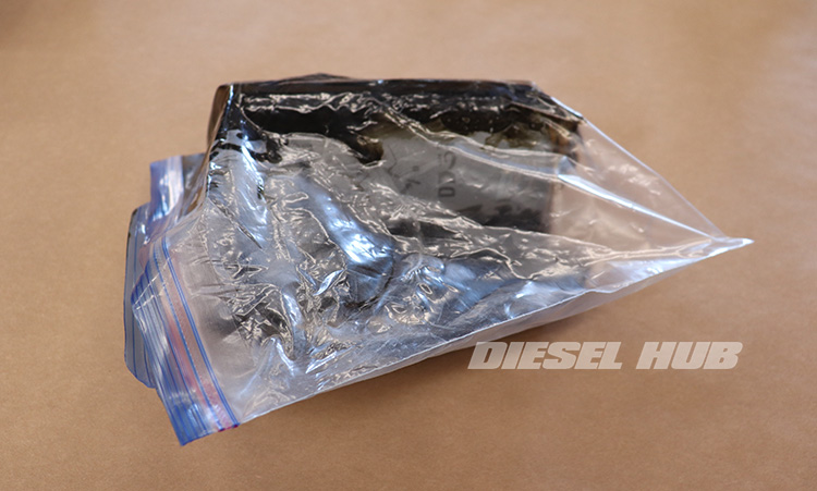 Engine oil filter caught in plastic freezer bag