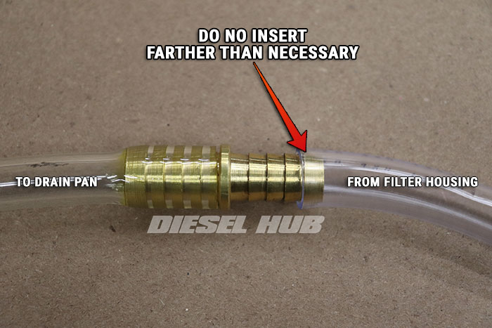 inserting barb fitting properly into drain hose