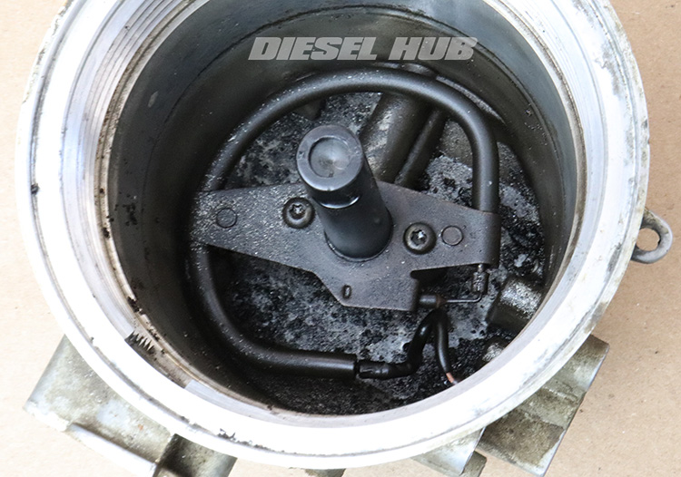 Sediment in the bottom of the fuel bowl on a 7.3 Power Stroke engine