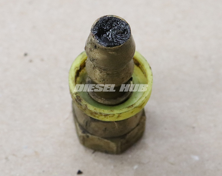 brass fitting clogged with biodiesel deposits