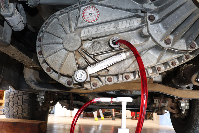 Filling transfer case with new fluid