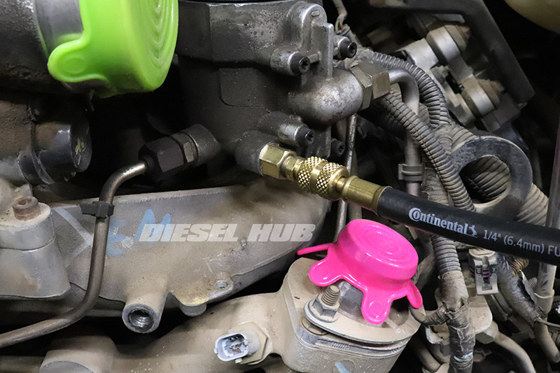 Test gauge attached to the fuel pressure test fitting