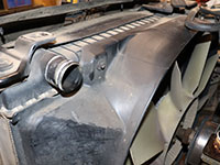 Driver side fan shroud bolt