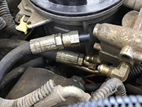 Return hoses removed and plugged