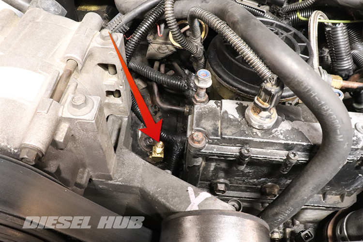 fuel pressure test fitting installed in cylinder head