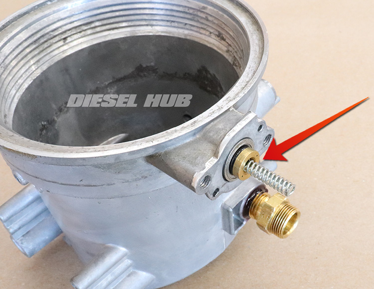 pressure regulator spring and poppet valve with the cap removed