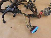 wire covering removed from engine wiring harness