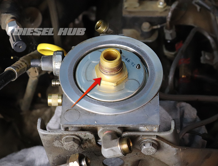 brass filter adapter threaded into bottom of filter base