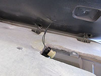 Disconnecting interior light socket from door panel